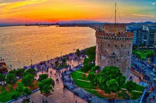 Aerial view of famous White Tower of Thessaloniki at sunset, Greece. Image taken with action drone camera. HDR image