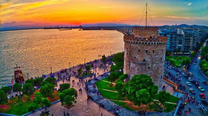 Aerial view of famous White Tower of Thessaloniki at sunset, Greece. Image taken with action drone camera. HDR image