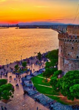 Aerial view of famous White Tower of Thessaloniki at sunset, Greece. Image taken with action drone camera. HDR image